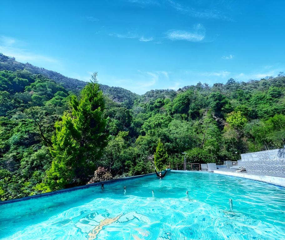 Haut Monde Hill Stream Resort and Spa Hotel in Dehradun with Swimming Pool